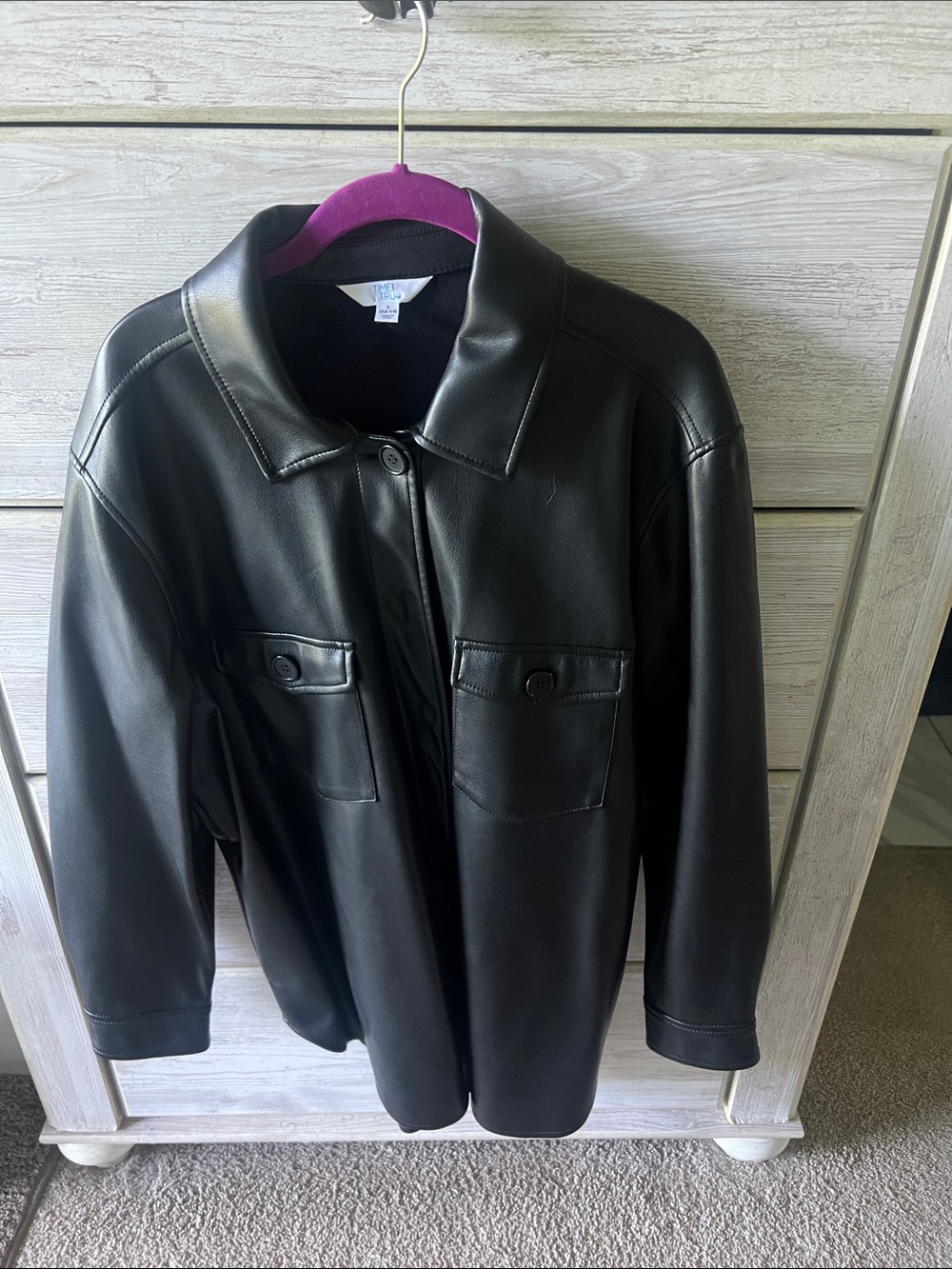 Women’s Black Faux Leather Button-Front Jacket. Runs full